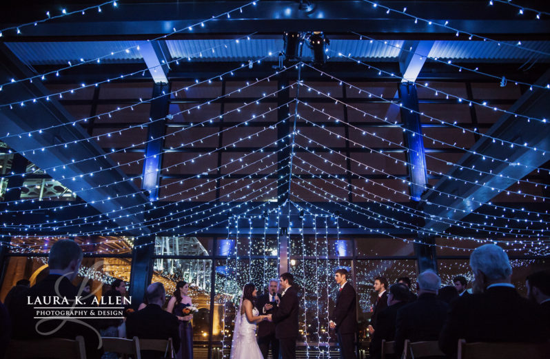 Blue string light canopy over wedding ceremony at The Bridge Building